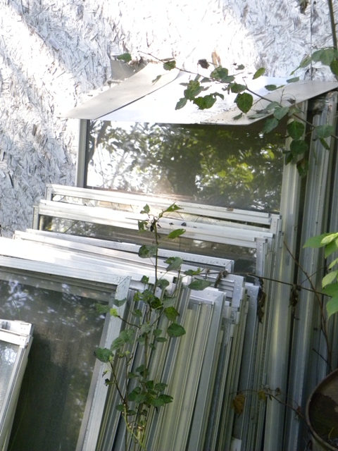 Windows with aluminum frames stored for recycling